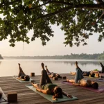 Morning Synergy Vinyasa yoga retreat on Koggala Lake, peaceful lakeside scene showcasing yoga retreat south coast sri lanka.
