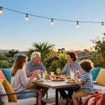 Family gathering around stylish outdoor seating furniture with vibrant cushions and cozy ambiance.
